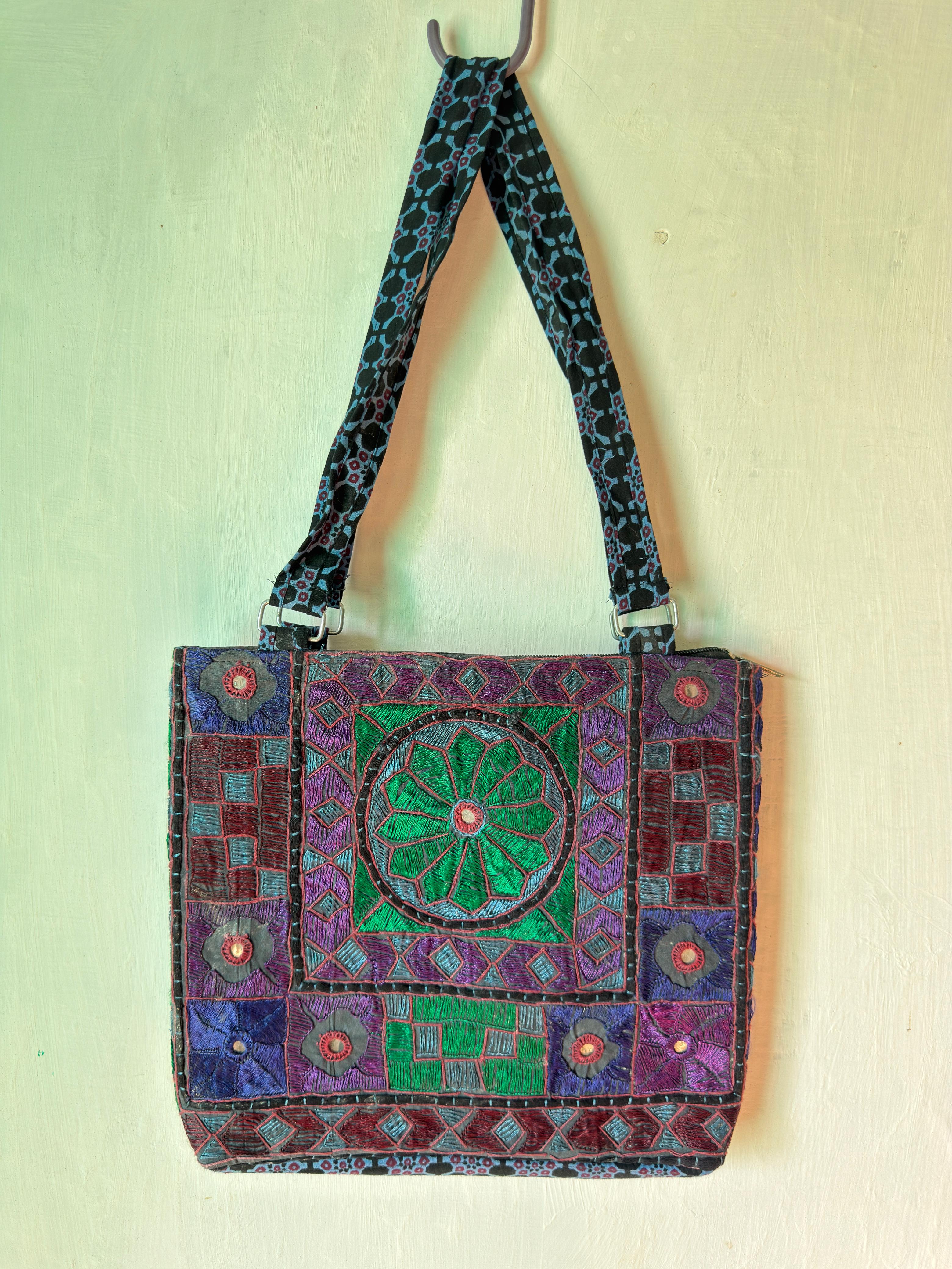 Rectangular shoulder bag with dense multicoloured geometric embroidery